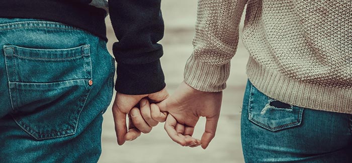 Image of couple holding hands for Quotacy blog Term Life Insurance for Couples.