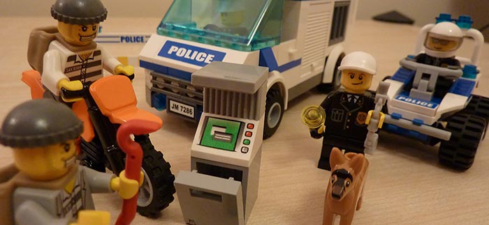Image of Lego police squad stopping criminals for Quotacy blog How Does a Criminal Record Affect Buying Life Insurance?