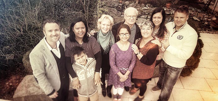 Image of happy multi-generational family for Quotacy blog How to Designate Beneficiaries on Your Life Insurance Policy.