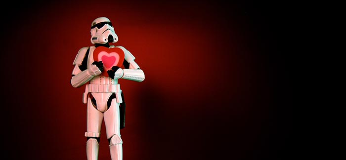 Image of Star Wars storm trooper holding a heart to his chest for Quotacy blog Getting Life Insurance After a Heart Attack.