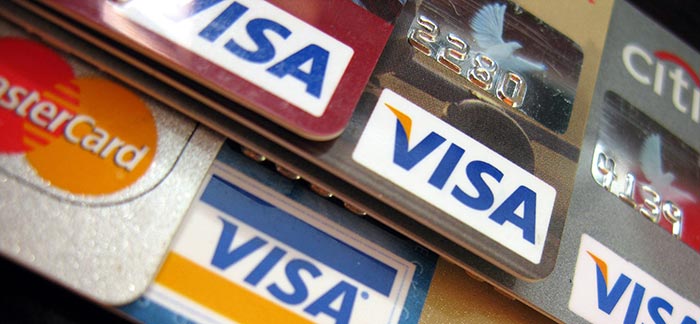 Image of stacked credit cards for Quotacy blog Habits of People with Good Credit.