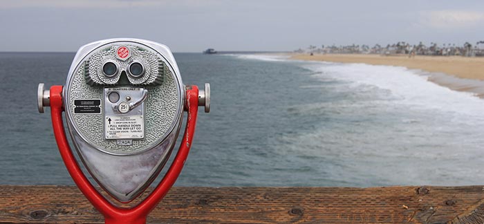 Image of seaside binoculars on a dock for Quotacy blog How Does Quotacy Find You the Best Priced Term Life Insurance?
