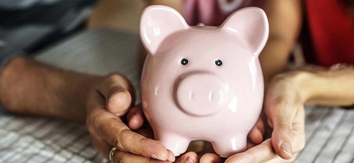 A piggy bank with parents and children