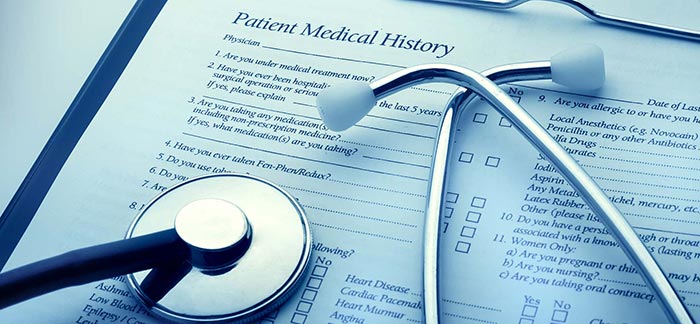 Image of stethoscope on a patient medical history form for Quotacy blog Life Insurance and Multiple Sclerosis: Buyer's Guide.