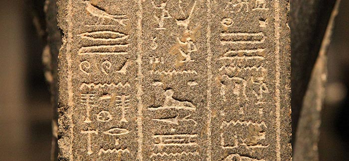 Image of Egyptian hieroglyphics stone tablet for Quotacy blog Clauses and Exclusions: Things to Know About Your Policy.