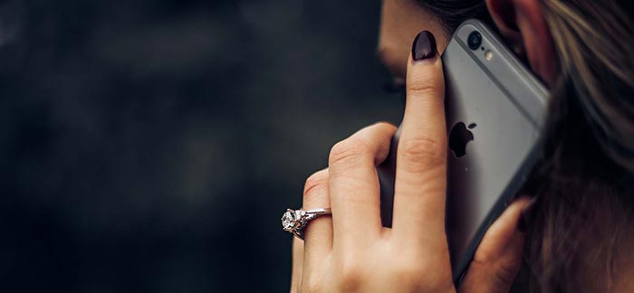 Image of woman talking on an iPhone