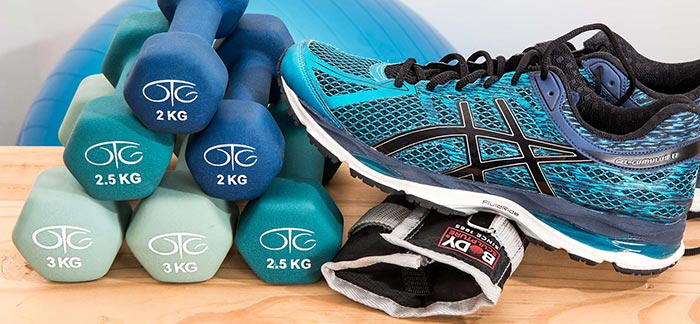 Image of dumbbells, leg weights, and running shoes for Quotacy blog How Do I Reduce My Chances of Developing Type 2 Diabetes?