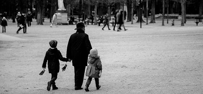 Image of grandparent walking with grandchildren in a park for Quotacy blog Estate Planning: Not Just for the Wealthy.