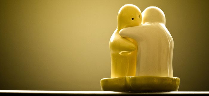 Image of hugging salt and pepper shakers for Quotacy blog Insure Your Love.