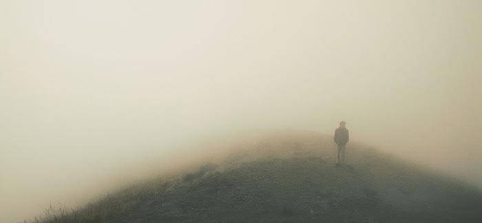 Image of person walking in fog