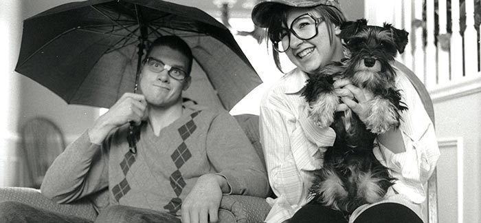 Image of brother & sister holding their dog having fun for Quotacy blog Why Does My Family History Affect My Life Insurance?