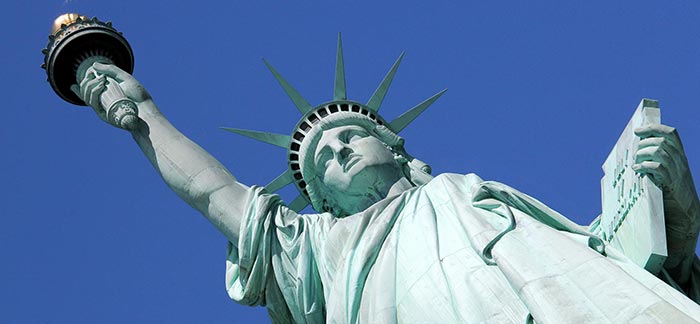 Image of Statue of Liberty at Ellis Island in New York for Quotacy blog: Life Insurance for Non-US Citizens.