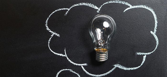Image of a lightbulb on a chalkboard for Quotacy blog Do You Know the Answers to This Life Insurance Basics Quiz?