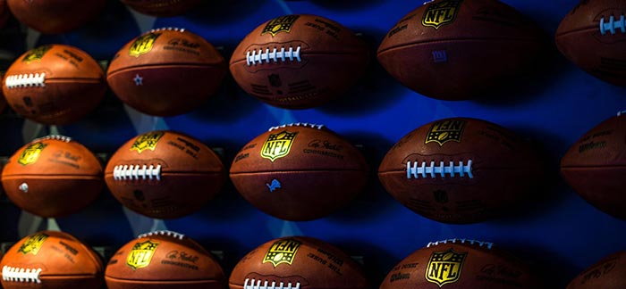 Image of NFL footballs for Quotacy blog Three Things Not to Do on Super Bowl Sunday.