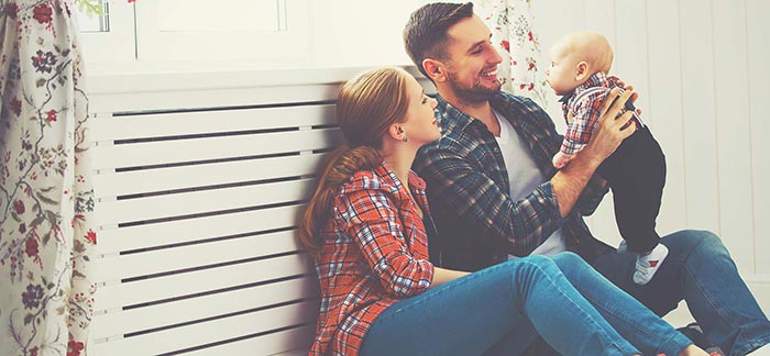 Young couple with baby for Quotacy blog What Is Return of Premium Life Insurance?