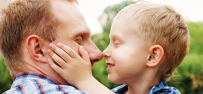 Image of father and son for Quotacy blog: 10 Signs Your Life Insurance Company Has Your Best Interests at Heart.