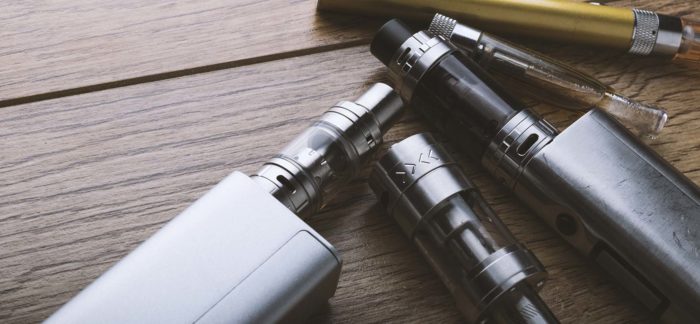 Image of several electronic cigarettes on a table.