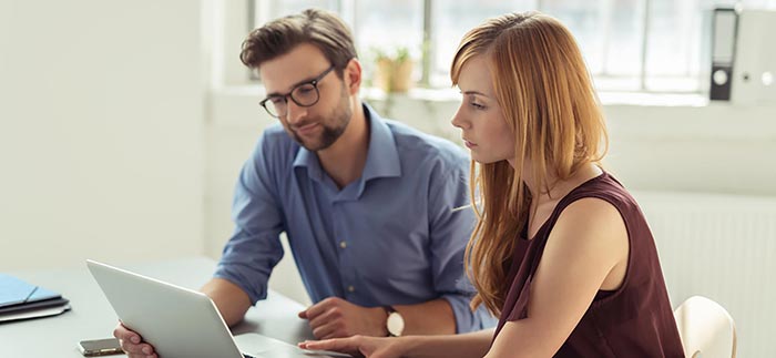 Young couple researching online for Quotacy blog A 5-Minute Guide to Renewable Term Life Insurance