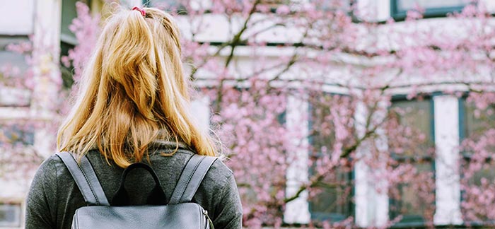 Young woman heading to college for Quotacy blog 5 Money Tips to Help You Live Your Best Life at College