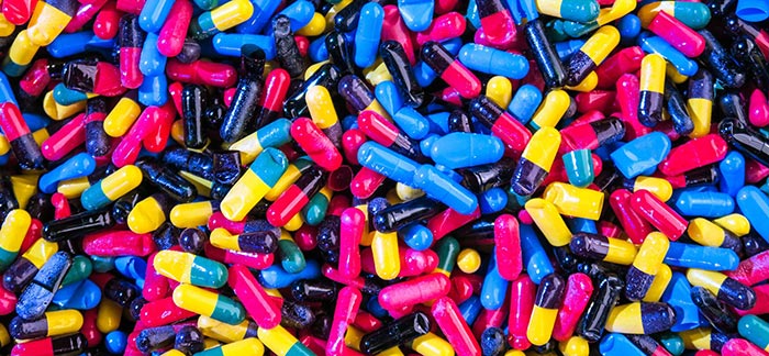 Colorful collection of prescription pills for Quotacy blog Can I get life insurance if I use opioids?