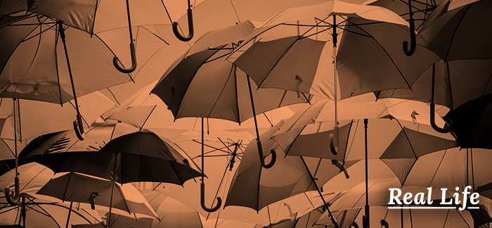 Image of umbrellas for real life podcast post about the reasons people buy life insurance.