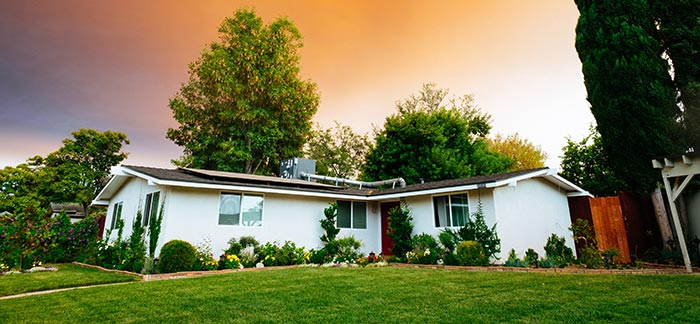 Image of a home during sunset for the Quotacy blog: How You and Your Family Can Use Life Insurance.