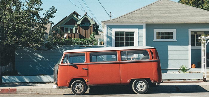 van outside house for Quotacy blog Should I Bundle Term Life Insurance Quotes with My Home or Auto?