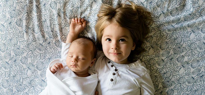 Little girl and her baby sibling for Quotacy blog Family Planning and Life Insurance Quotes