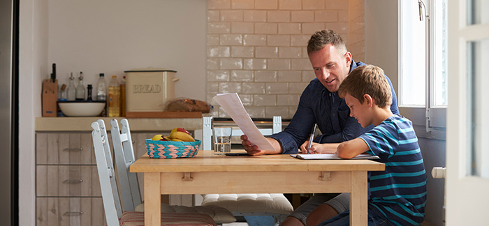 A father and son working on homework