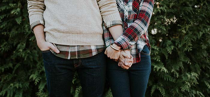 image of two people holding hands