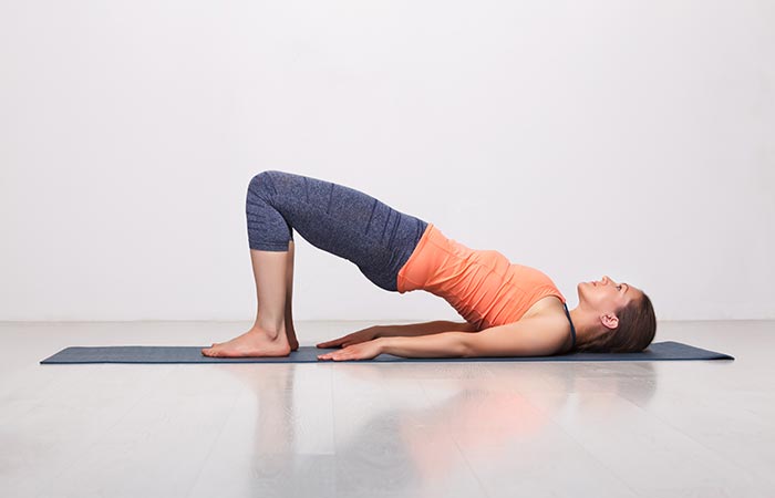 woman in bridge yoga pose