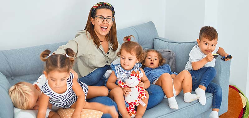 Mom on the couch with five of her children. 