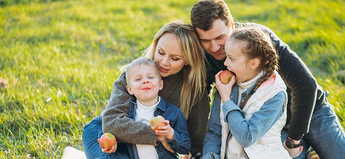 mom dad and children at picnic for Quotacy blog cost of $250,000 life insurance policy