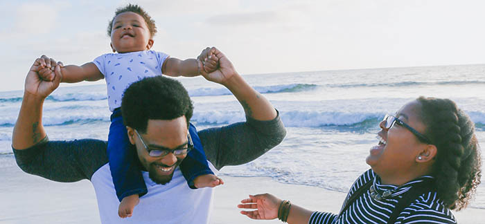 multi-racial family on beach for Quotacy blog What is life insurance do I need life insurance
