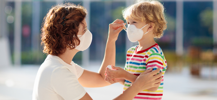 mom and child in masks for Quotacy blog covid pandemic impact on life insurance