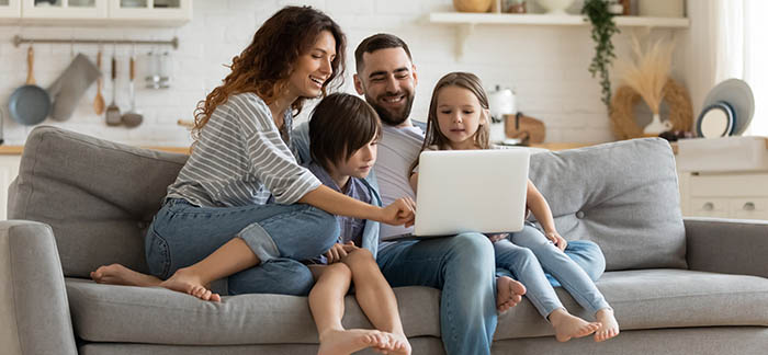 young family on computer for Quotacy blog things to know about policy ownership