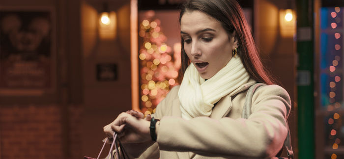woman checking watch during holiday rush