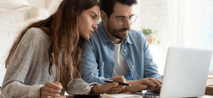 Couple discussing the pros and cons of infinite banking strategies