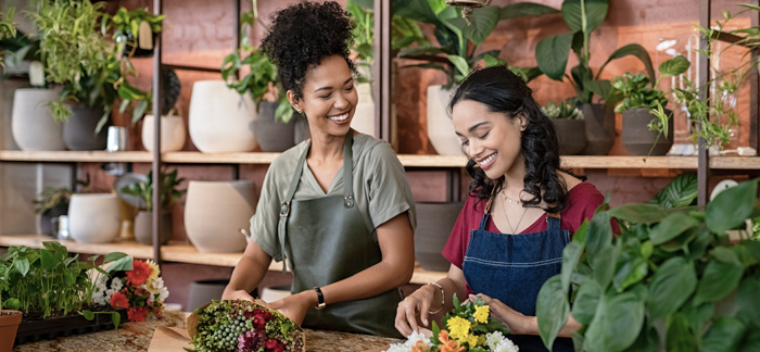 two female business owners working in their flower shop
